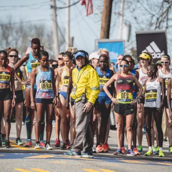Runners lined up at the start of a race, focused and ready.