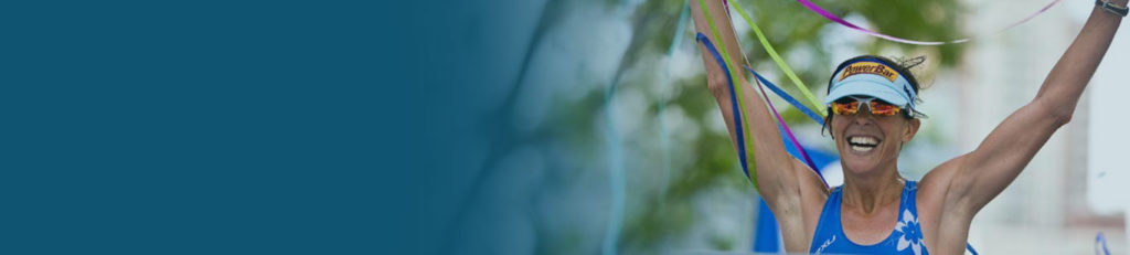 Blurred image with blue and green hues creating an abstract natural scene.