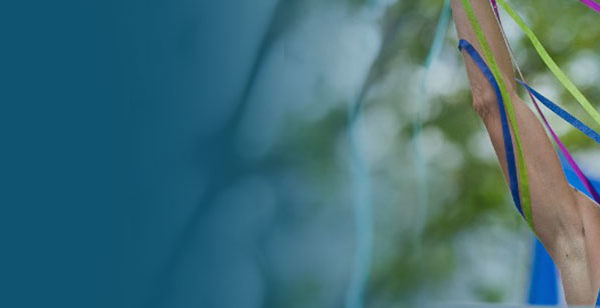 Blurred image with blue and green hues creating an abstract natural scene.