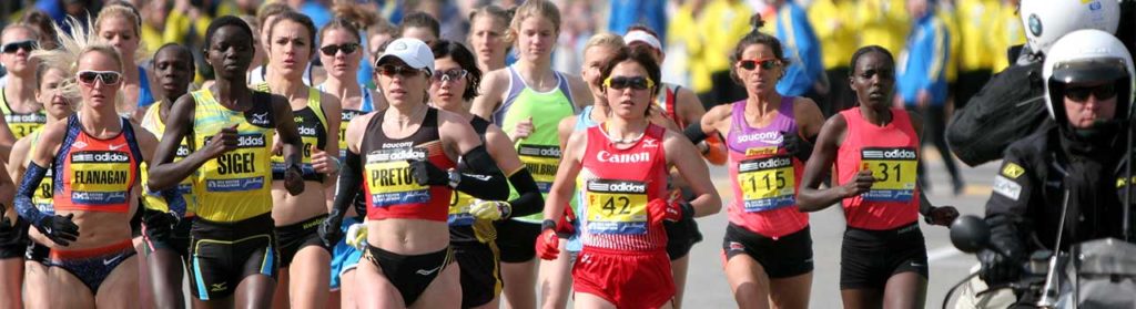 Runners competing in a marathon on a sunny day.