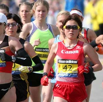 Runners competing in a marathon on a sunny day.