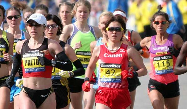 Runners competing in a marathon on a sunny day.