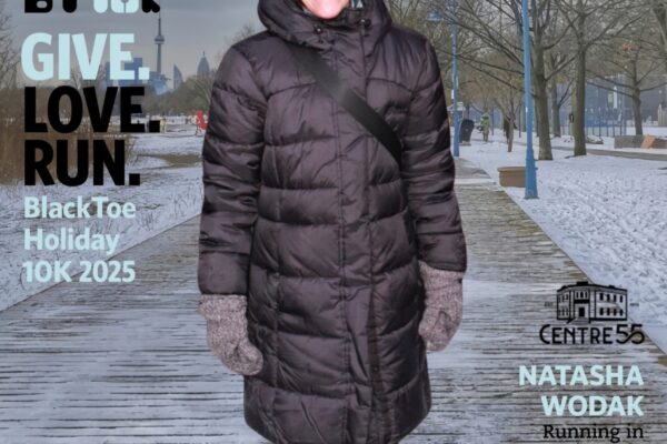 Woman in winter coat promoting a holiday 10K run event.