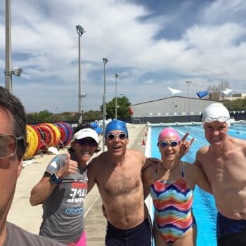 Group of friends enjoying a sunny day outdoors by the water.